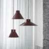 Muuto Top pendant lamp by Big-Game featuring contemporary cone design with spun steel construction