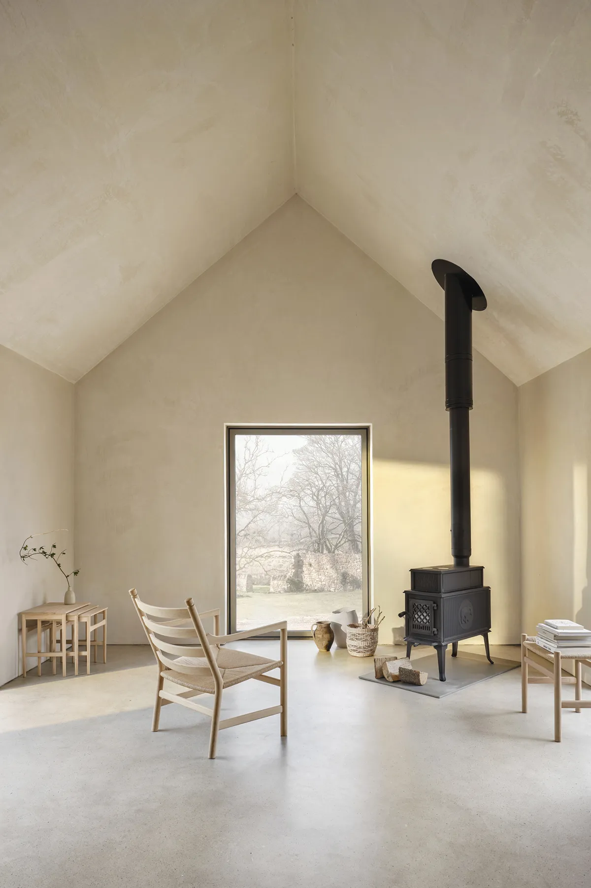 CH004 nesting tables by Hans J. Wegner featuring three graduated sizes with tapered legs and organic design details