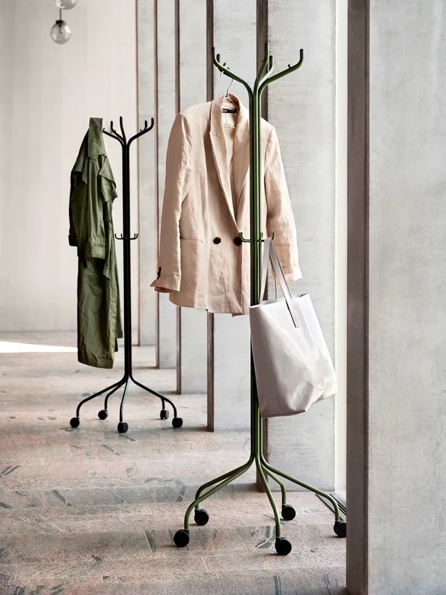 Roll mobile coat hanger by Louise Hederström featuring tree-inspired design with five wheels