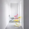 Zola chair collection displaying four color options including white red yellow and black powder coating finishes