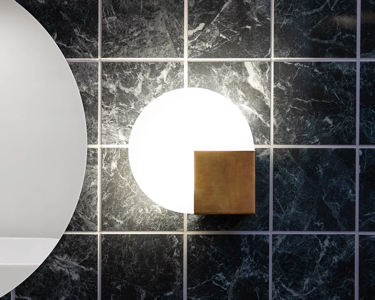 Sun wall light by Addi for Örsjö featuring integrated LED and brass-glass geometric design