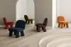 Transformed Maximus easy chair by Johan Ansander for Blå Station, evolving from all-wood construction to springy lushness.
