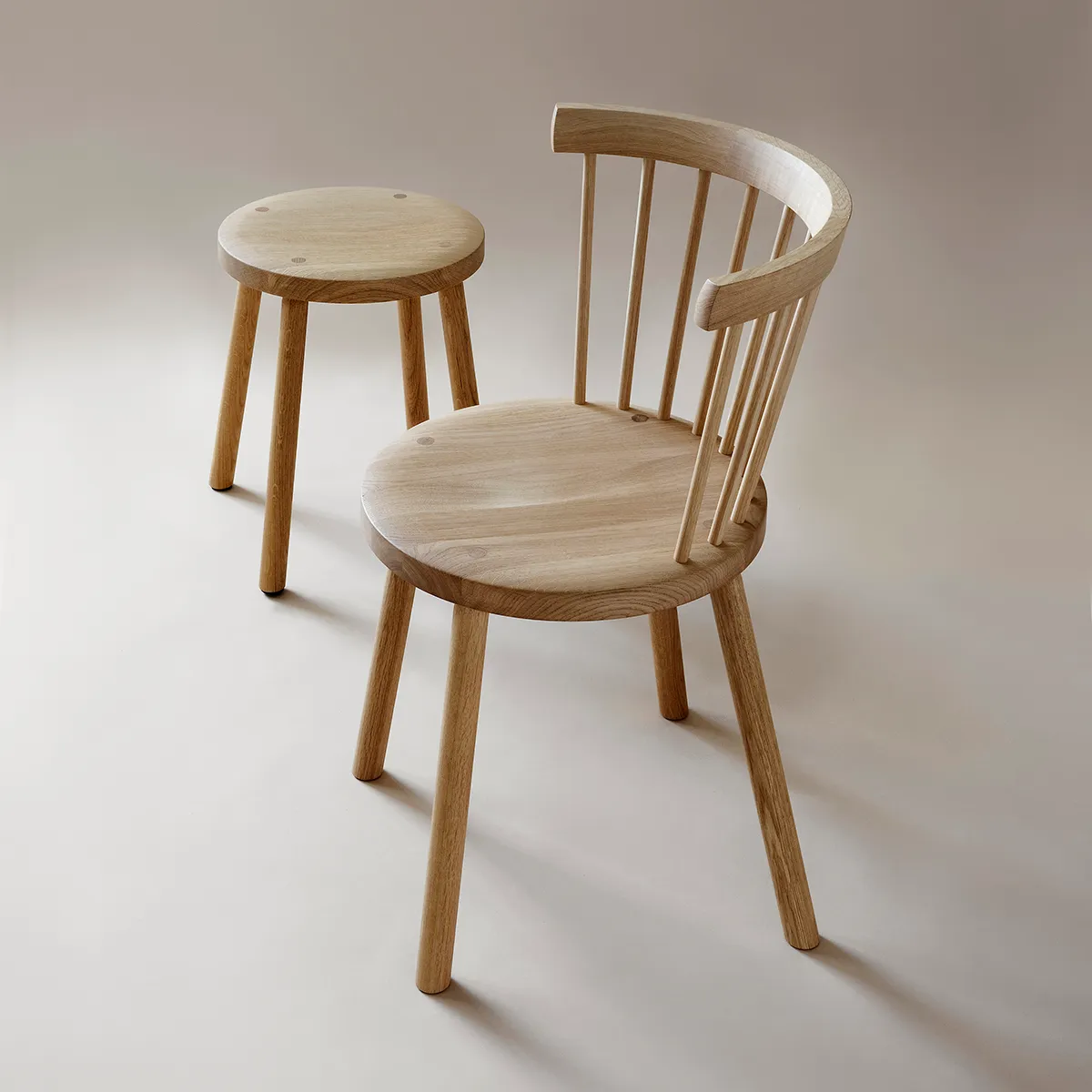 Storia collection including chair and stool variations, demonstrating Nikari's woodworking expertise