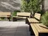 Perpendicular system by Thomas Bernstrand for Nola featuring angular wooden slats and steel frame construction