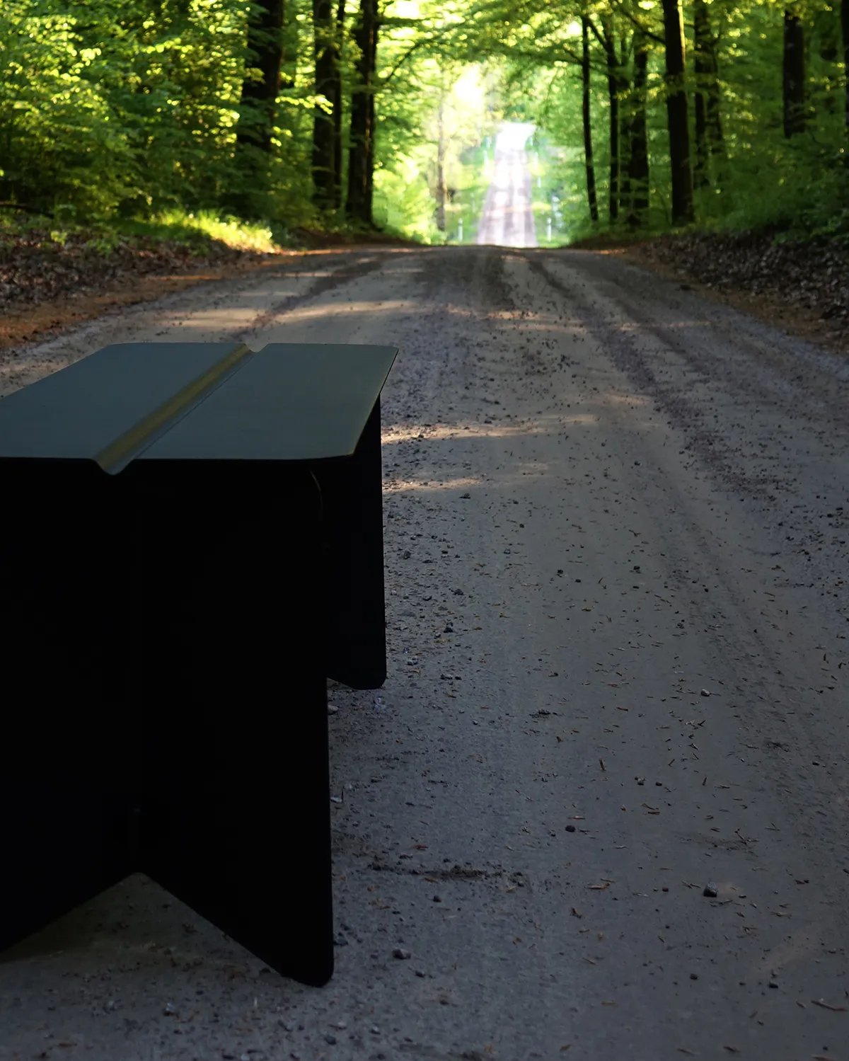 Stream bench by Monica Förster for SMD Design featuring geometric form with multiple angular planes