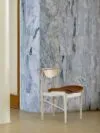 Finn Juhl's Reading Chair in ash wood by House of Finn Juhl featuring organic sculptural form