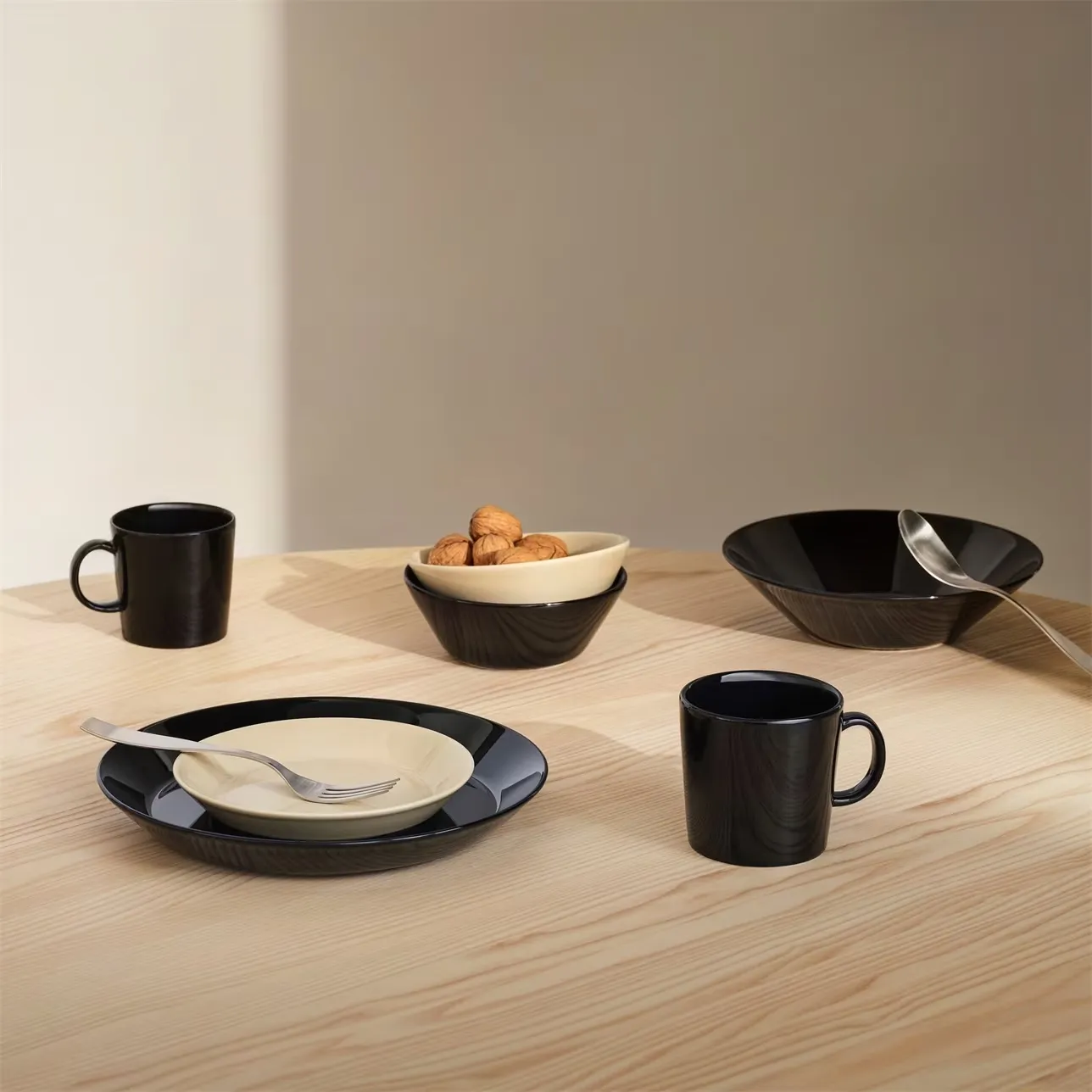 Black Teema tableware collection by Kaj Franck for Iittala featuring geometric forms and pure lines