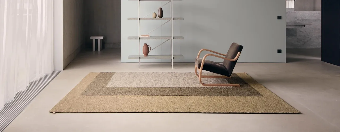 Tegel bouclé rug collection by David Chipperfield for Kasthall featuring architectural grid patterns and rich texture