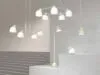 Bird lamp collection by Färg & Blanche for Belid featuring pendant, table, and floor variants in an exhibition setting