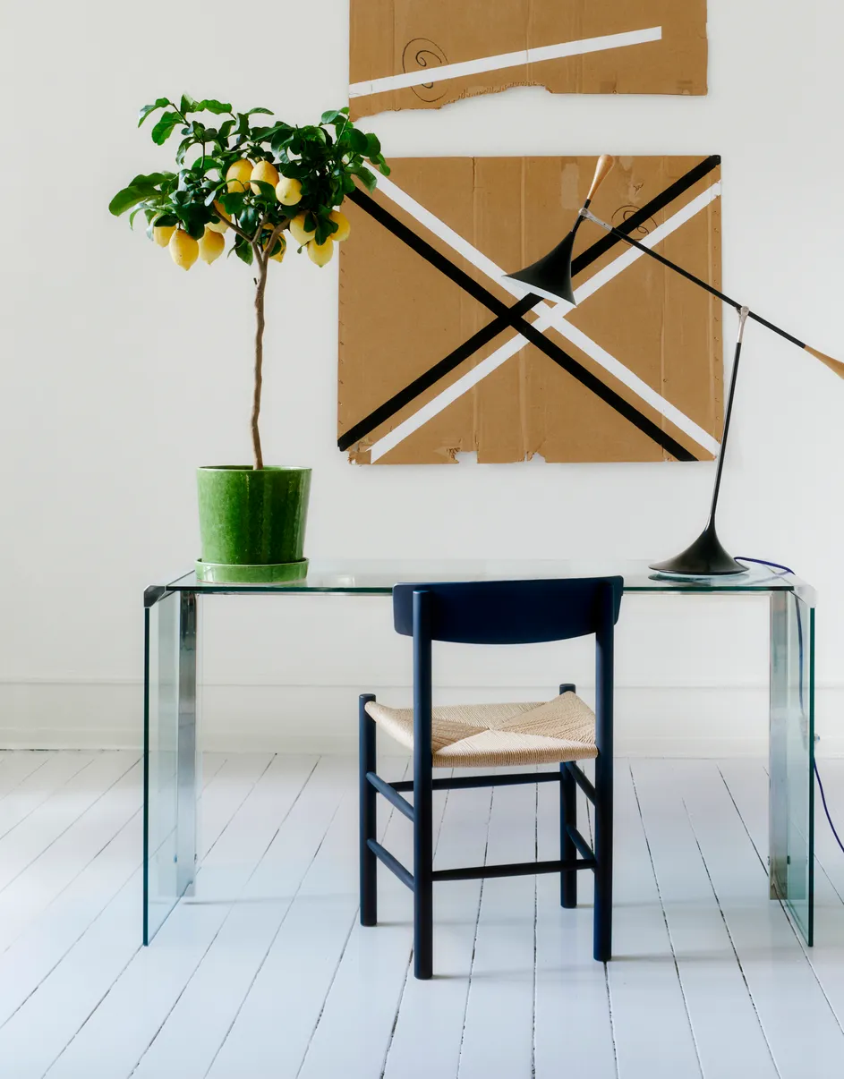 Børge Mogensen's iconic J39 chair by Fredericia displaying new artistic colorways alongside traditional natural finishes