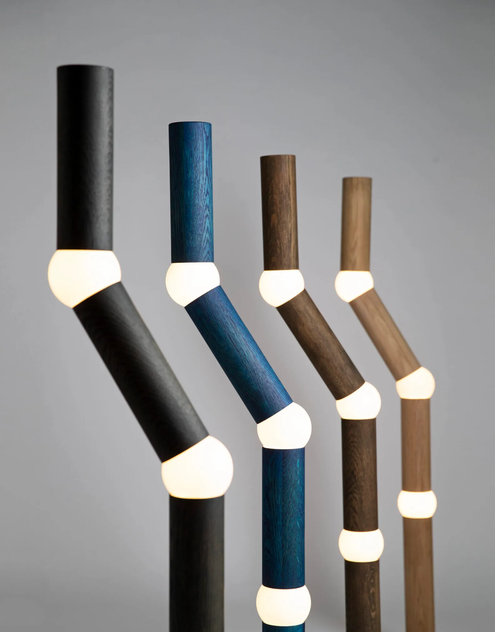 Lightbone lighting by Färg & Blanche for Oblure featuring solid oak construction with spherical opal glass joints