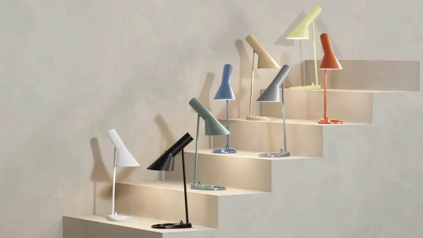 Louis Poulsen's AJ lamp family featuring the complete new color palette designed by Arne Jacobsen arranged in a display