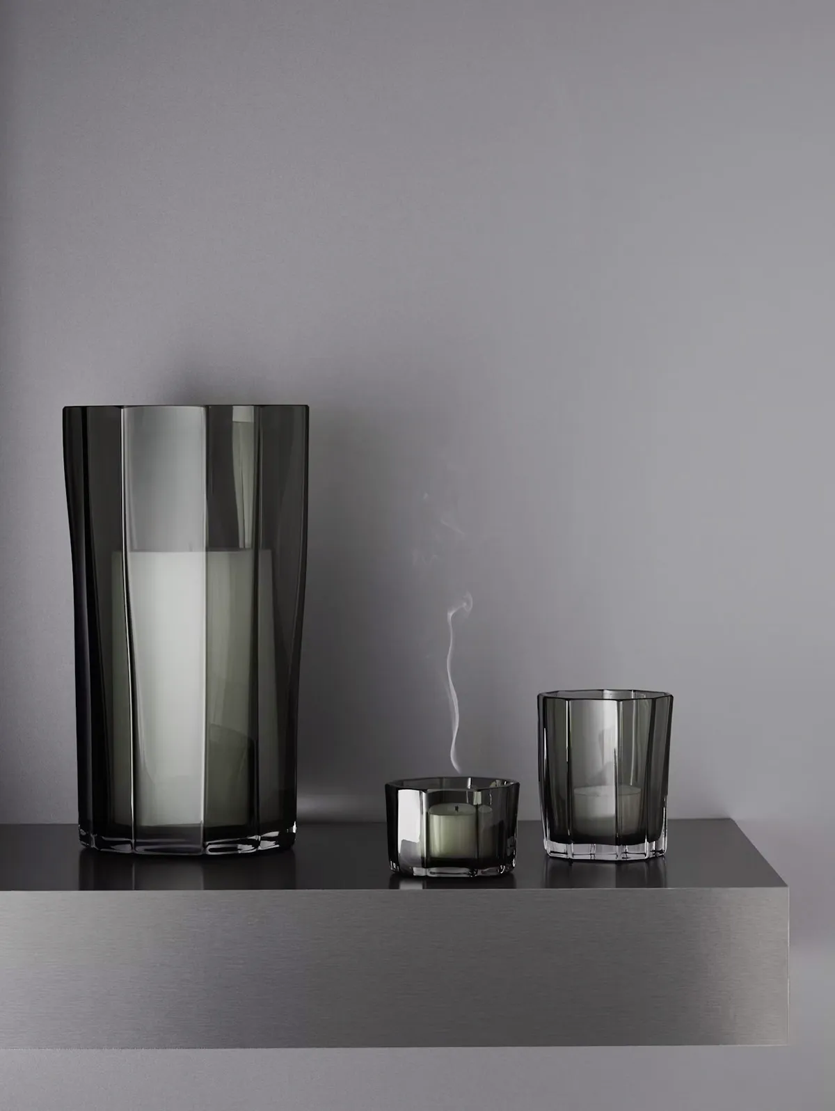 REED glass collection by Monica Förster for Orrefors featuring organic poetry through expanded range with vase, tealights, and storm lantern