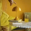 PANTHELLA portable lamp by Verner Panton now available in stunning yellow finish bringing vibrant portable illumination option