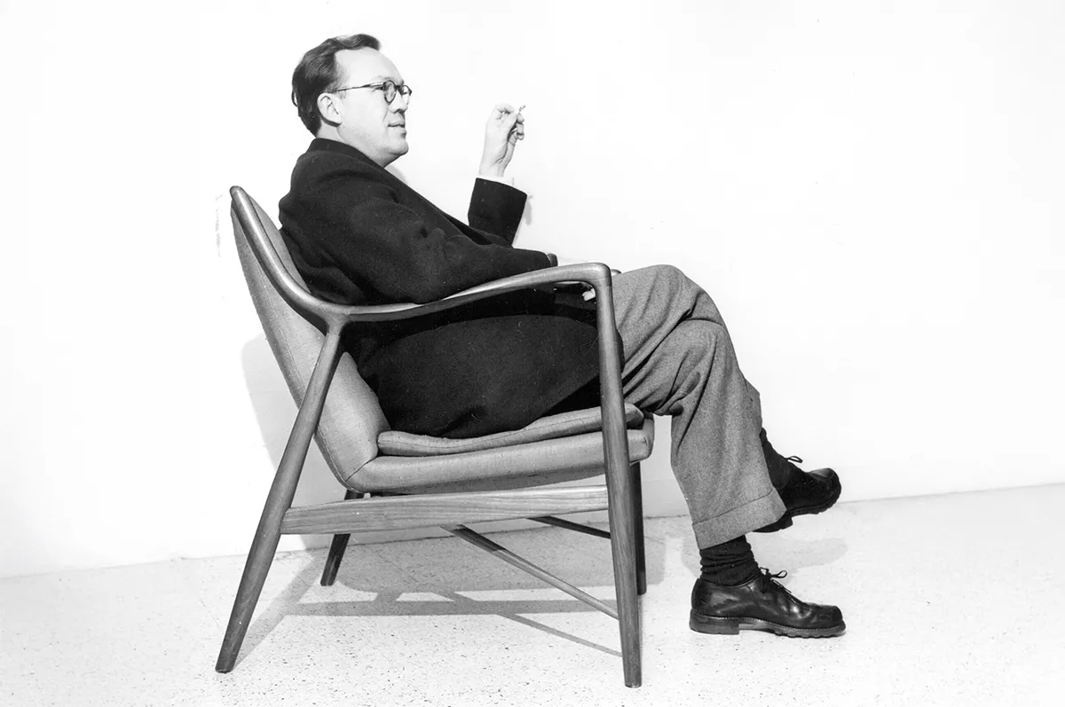 Finn Juhl Danish furniture designer creating sculptural mid-century modern chairs and sofas with organic shapes refined details