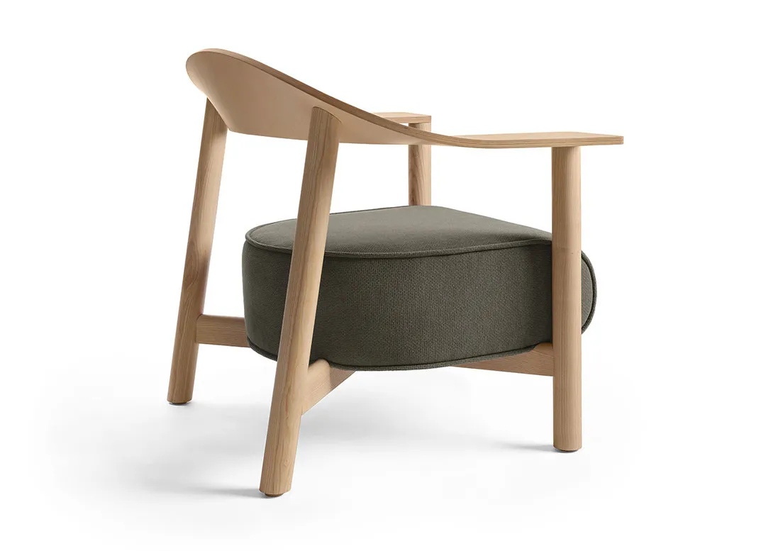 Dais lounge chair by Form Us With Love for Keilhauer featuring a sculptural backrest with three-dimensional skew design