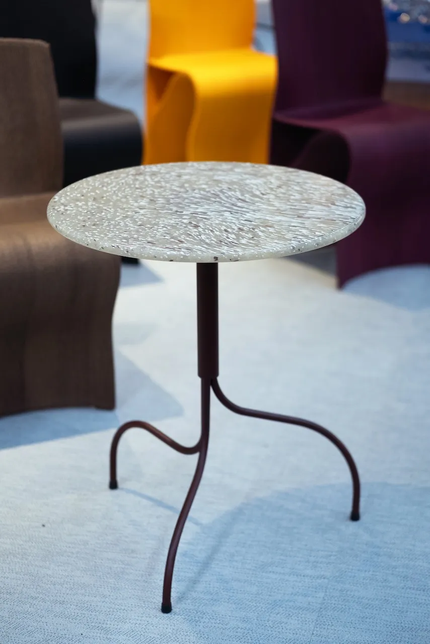 Reimagined iconic Liv table as Liv Tundra displaying sustainable Scandinavian design through upcycled materials and Jonas Bohlin's signature water-inspired steel base