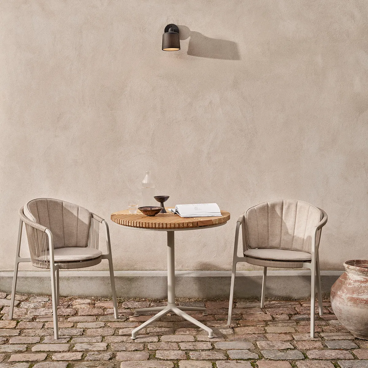 view of Vipp Lagrasse chairs showing the light, airy design and elegant cord detailing