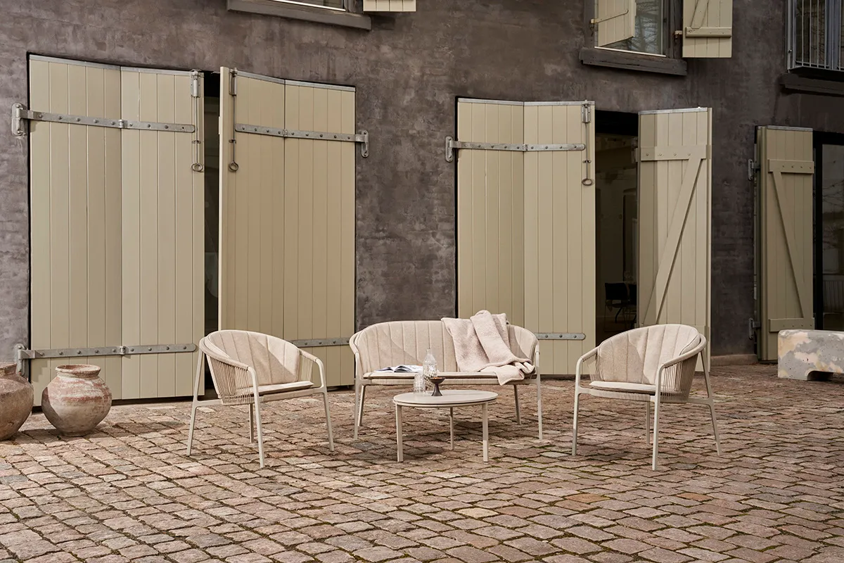 Vipp Lagrasse outdoor furniture arranged as a complete lounge set, demonstrating the collection's flexibility for small spaces