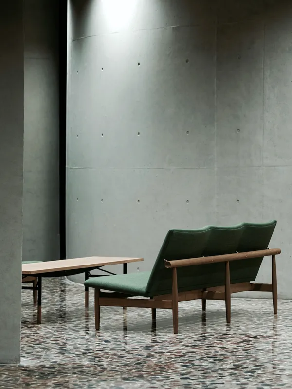 Japan Series collection by Finn Juhl including lounge chair, sofa, and footstool showing design consistency across the 1957 line.