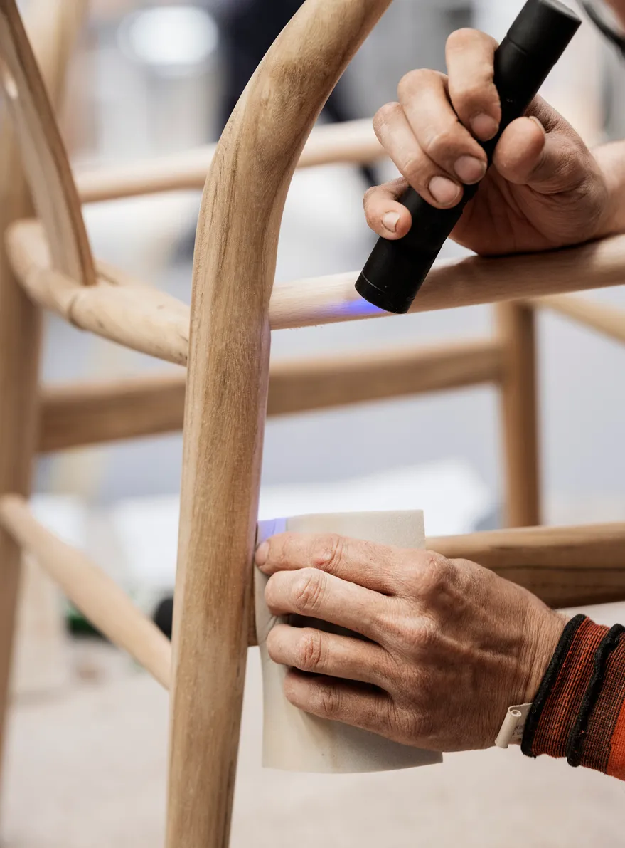 Close-up of genuine CH24 Wishbone Chair joinery showing precision craftsmanship and superior wood quality from Carl Hansen & Søn