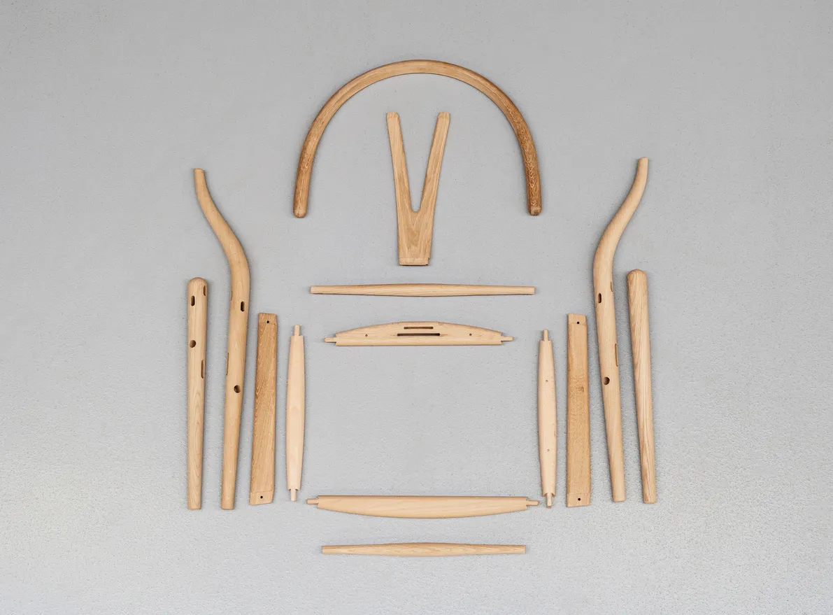 Carl Hansen & Søn authentic Wishbone Chair crafted with sustainable wood showcasing the iconic Y-shaped backrest and handwoven seat