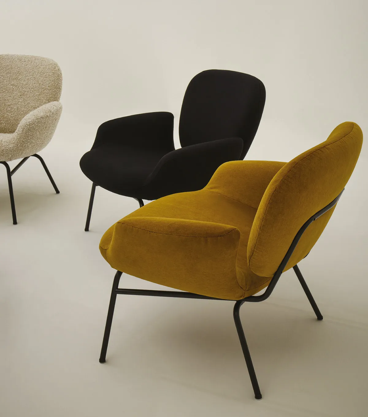 MOMO armchair with rounded cushions on tubular metal frame, showcasing Claesson Koivisto Rune's 2025 design