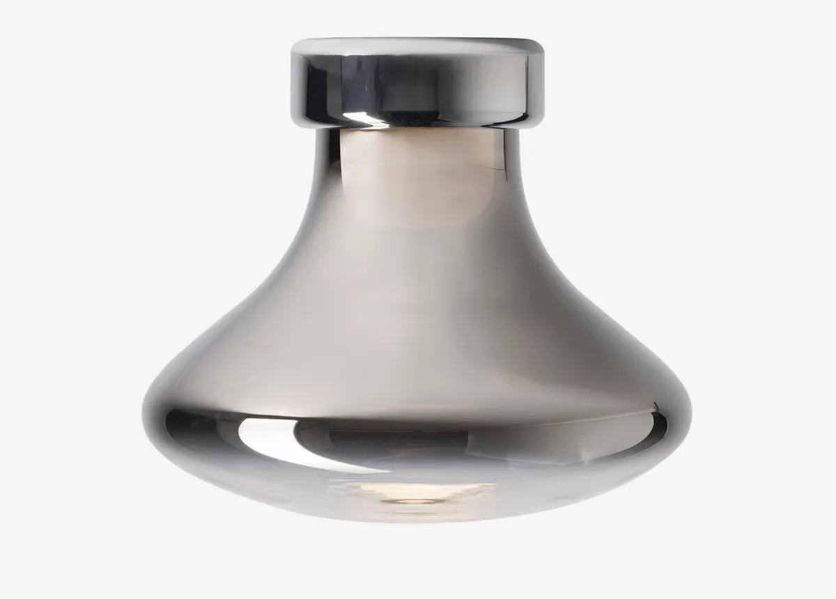 Organic-shaped Nebula lighting fixture with gradient metallic finish that dynamically mirrors surroundings even when unlit