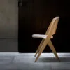 Lavitta chair in light wood finish showing rounded corners and tapered legs against minimal background