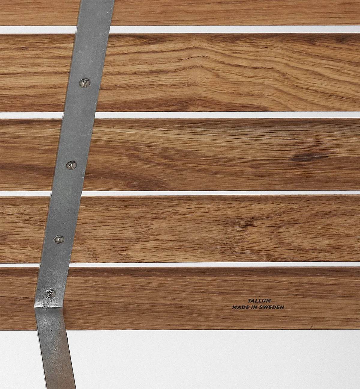 Modernist Stockholm Table with galvanized steel frame and natural wood top, designed for outdoor spaces