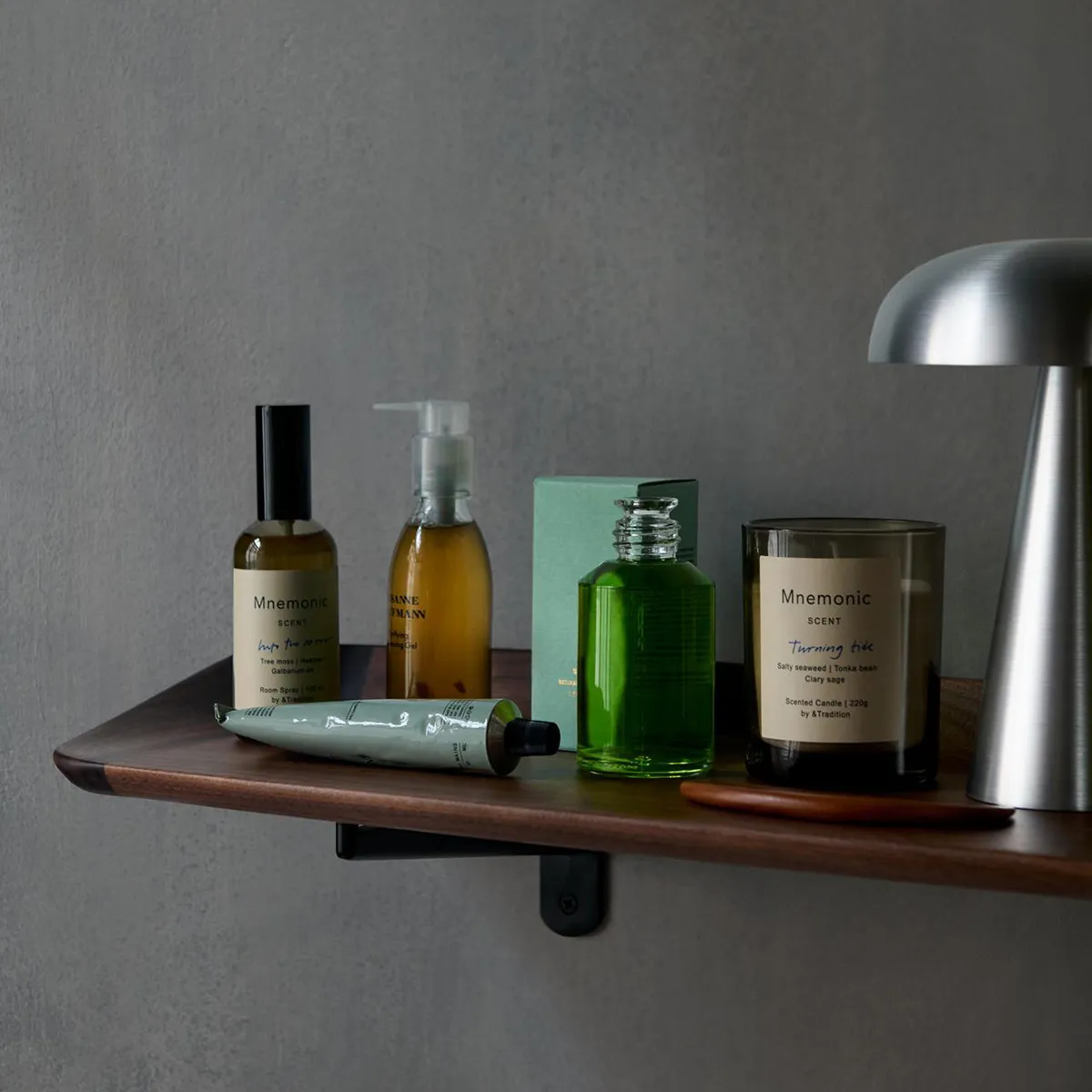 Guild shelf HM15 in walnut finish mounted in living space featuring curated objects emphasizing its sculptural quality