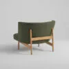 Arcata lounge chair by Anderssen & Voll for Davis showing curved silhouette with exposed oak wood base design