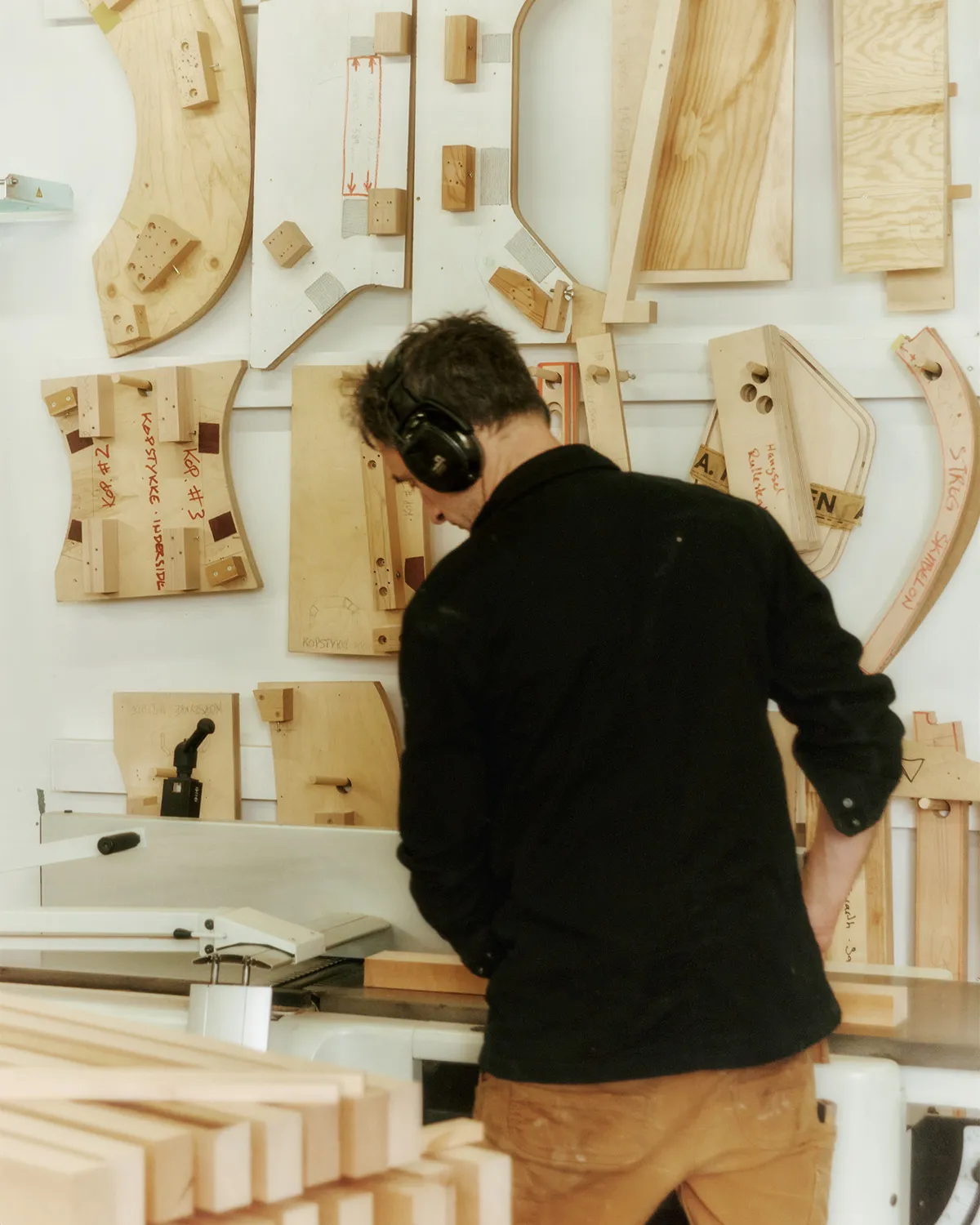 Danish workshop craftsmen assembling Nanna Ditzel bench using traditional woodworking techniques
