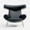 Hans J Wegner Ox Chair black leather Erik Jørgensen production showcasing sculptural design aesthetic