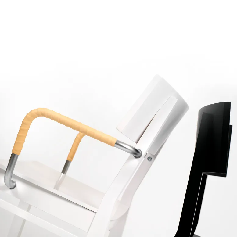 Close-up bentwood construction detail GUTE chair beech wood grain leather wrapped arms Mattias Ljunggren