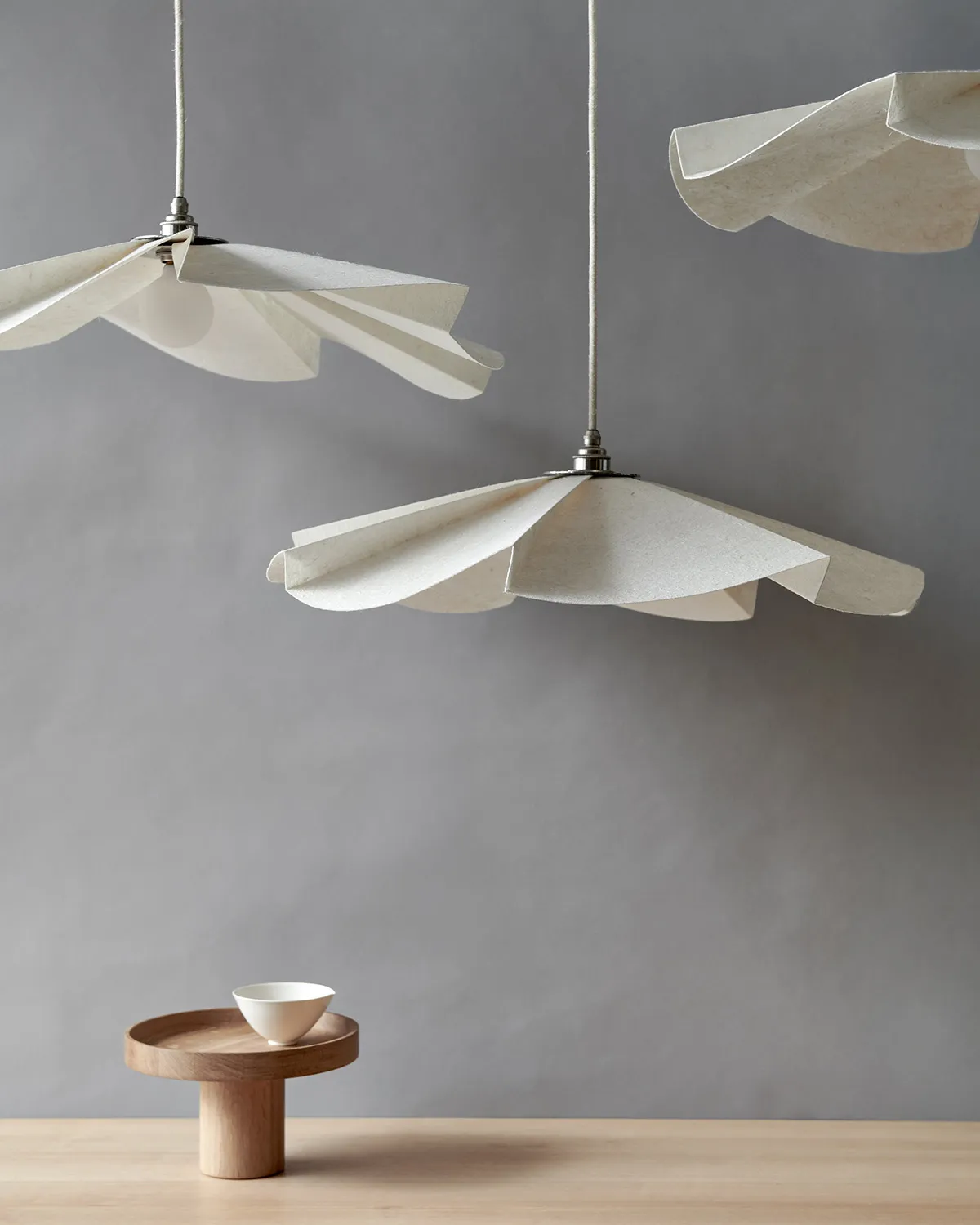 Side profile of Ingegerd Råman Silent Light pendant displaying elegant floating silhouette