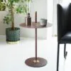 Cabaret side table by Peter Andersson for Klong with leather-wrapped pillar and brass details in black finish