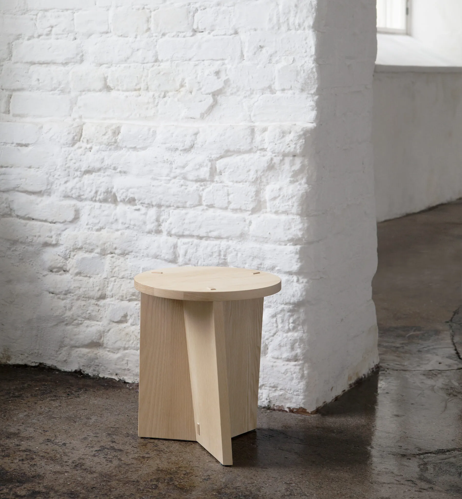 Marfa Stool in contemporary art gallery setting demonstrating versatile furniture design by Nikari CKR