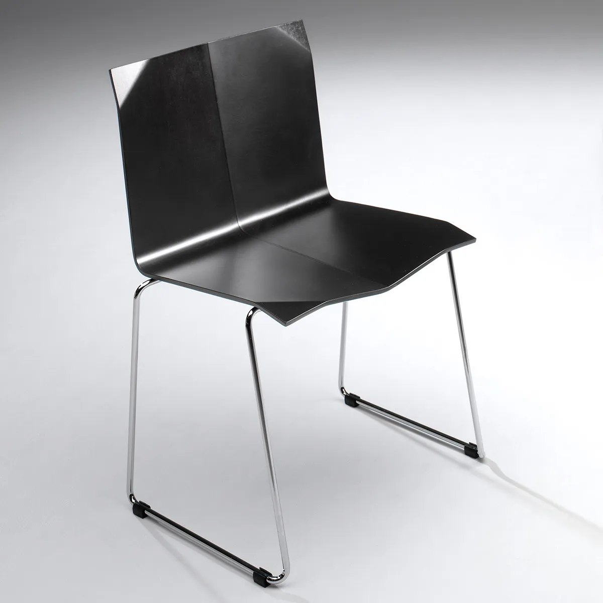 Chrome steel frame construction Origami chair industrial materials Sigurdur Gústafsson contemporary design