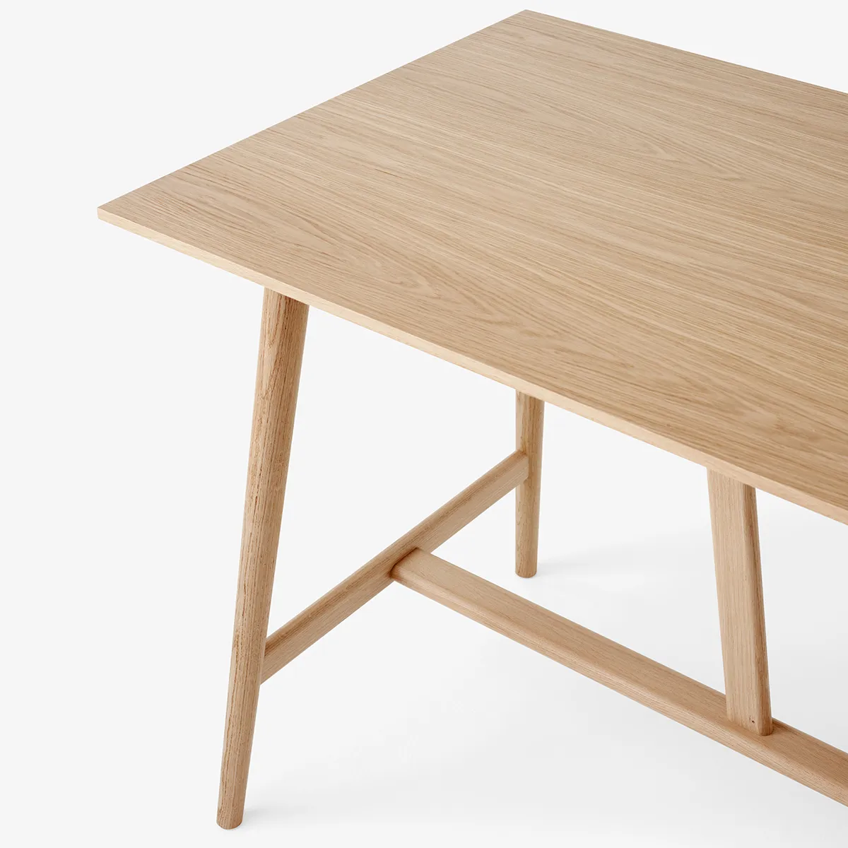 Close-up In Between table angled support detail showing bridge construction and solid oak craftsmanship