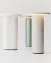 Solae portable lamp by Cecilie Manz for Fritz Hansen featuring oval aluminum base and circular LED top
