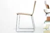 TORRO stackable chair by Jonas Lindvall for Skandiform featuring chrome metal runners and birch wood seat