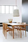 Oak Chair by Jonas Lindvall in modern Scandinavian dining room interior with natural lighting