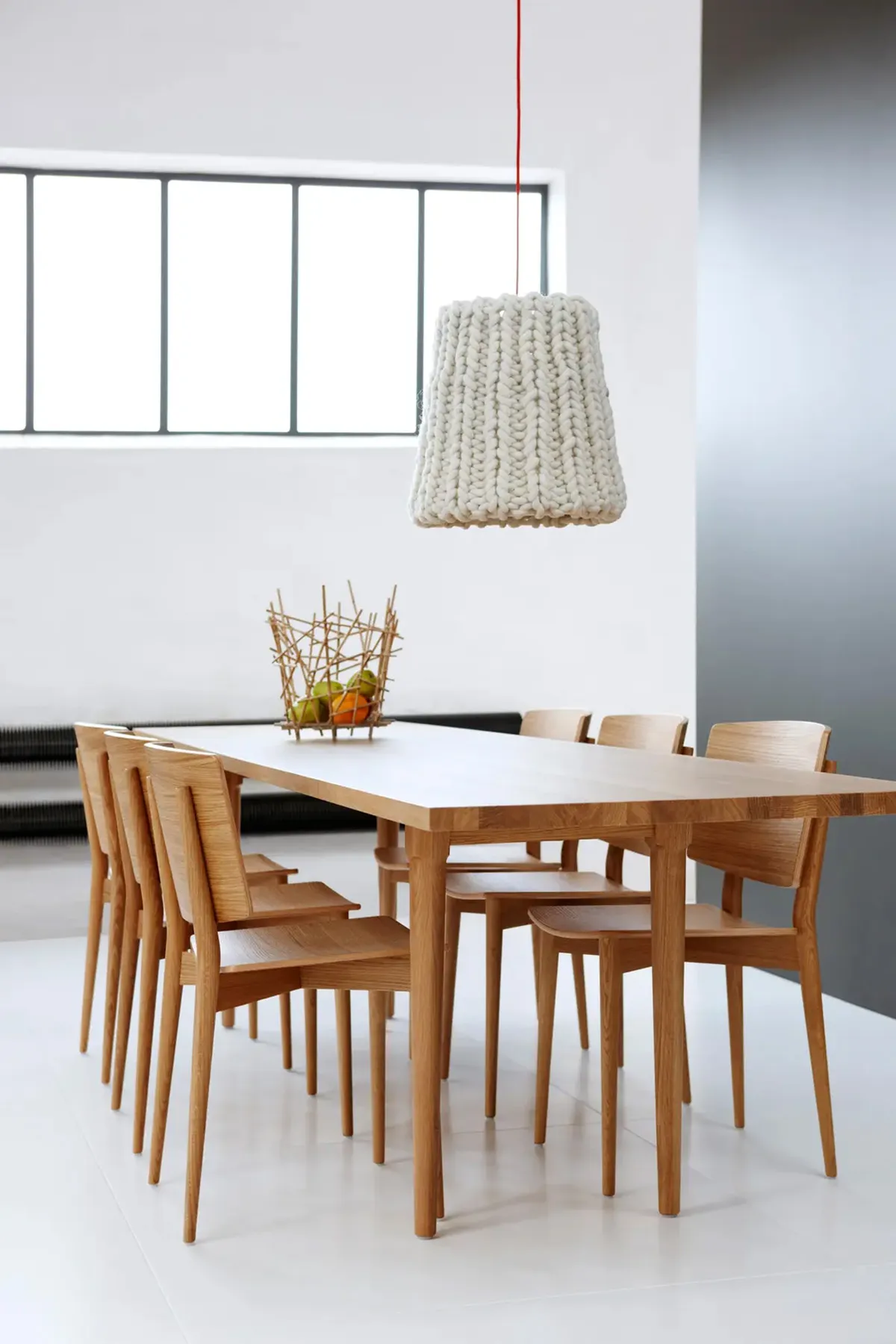 Oak Chair by Jonas Lindvall in modern Scandinavian dining room interior with natural lighting