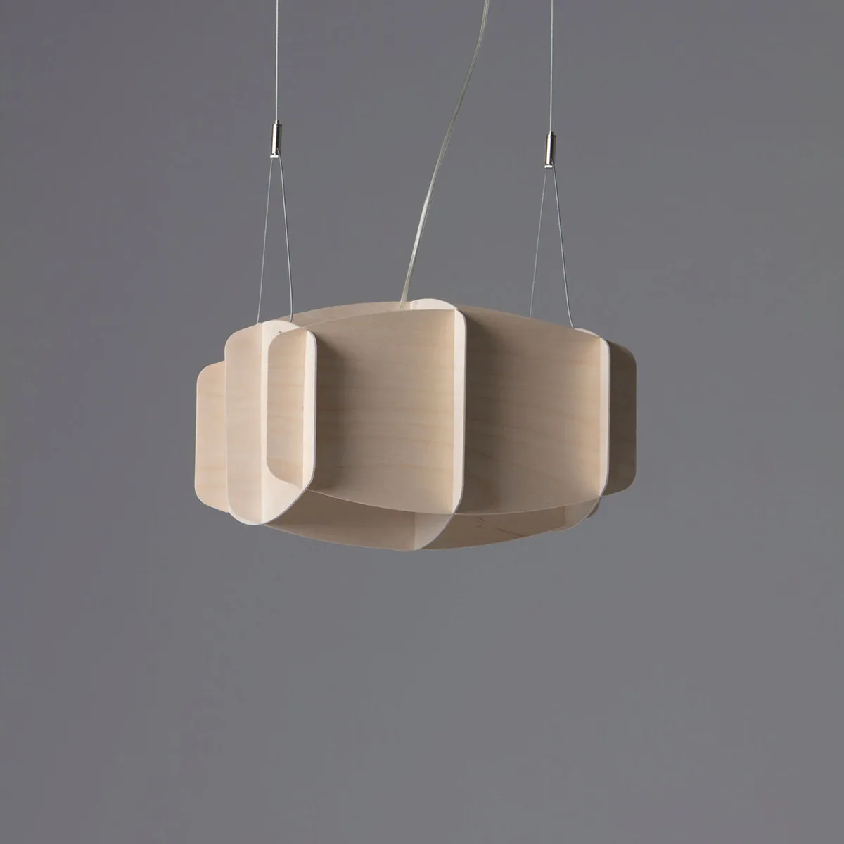 Side profile view of Ristikko architectural pendant lamp highlighting geometric birch construction