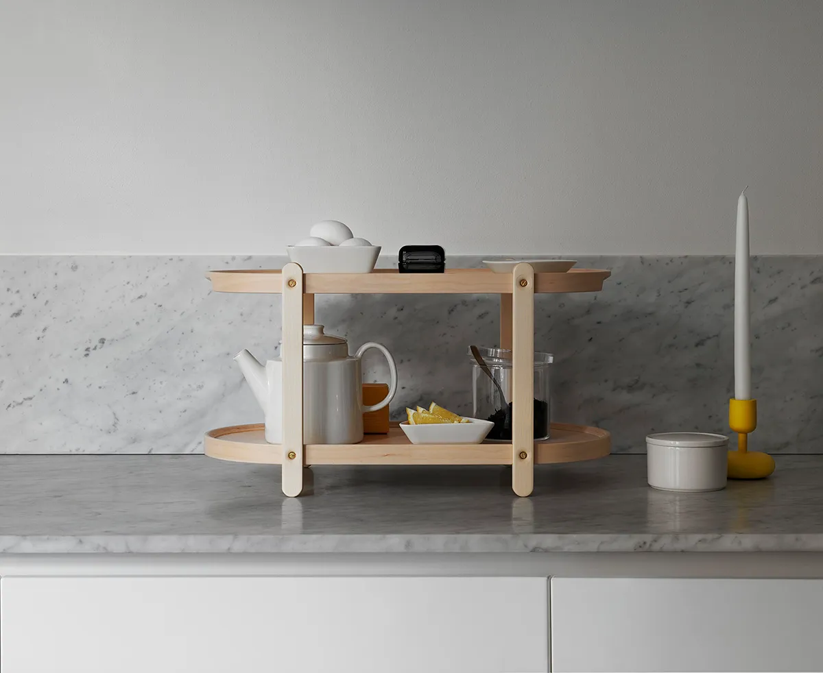 Kerros by Iittala used as serving tray and table for entertaining showing multi-purpose functionality