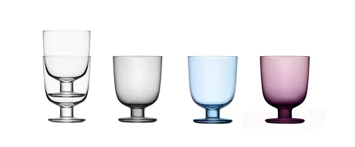 Matti Klenell Lempi glass collection for Iittala showing clear, purple, light blue and grey stackable stemware
