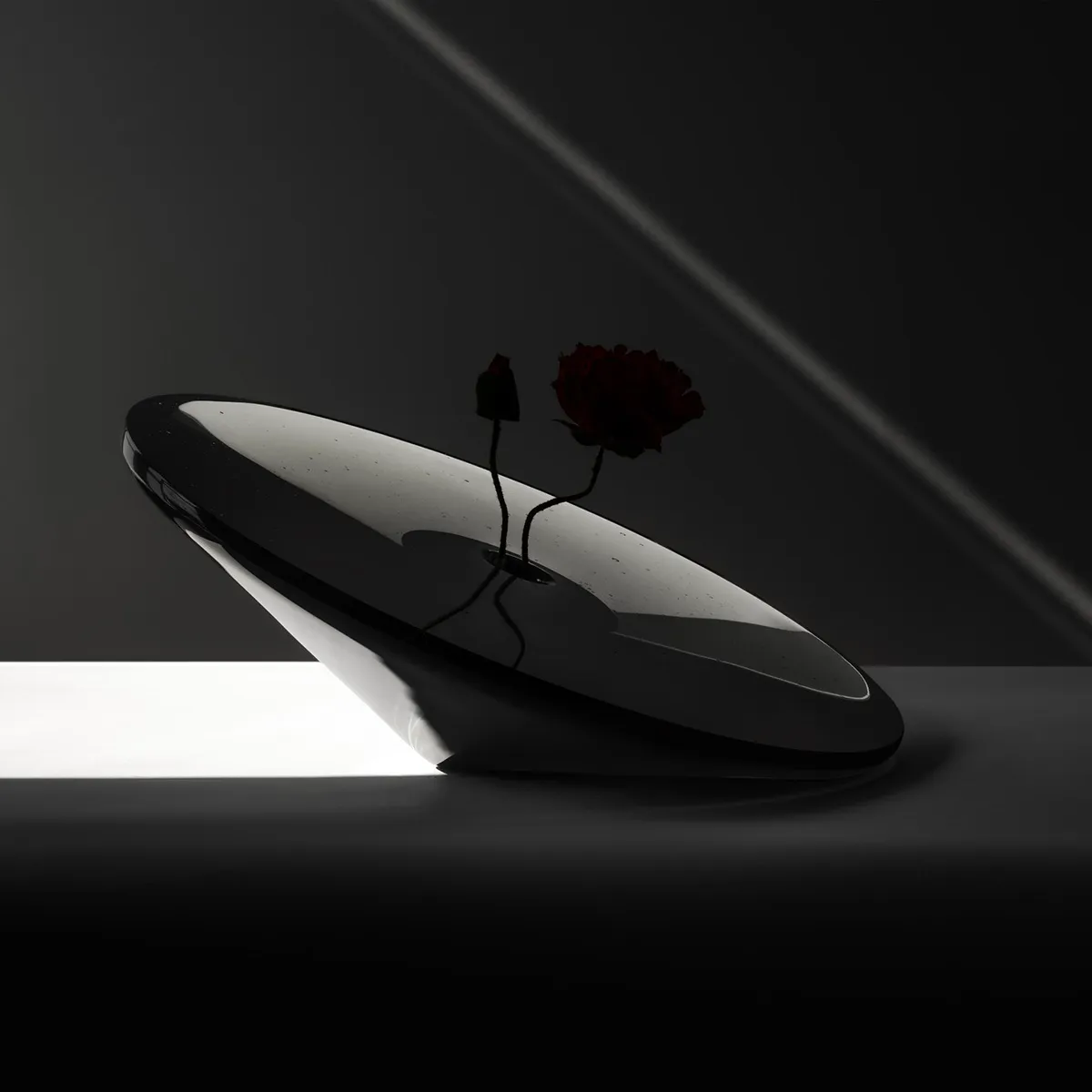 The Black Hole Vase by Claesson Koivisto Rune Architects, crafted with Orrefors glassworks for Expo 2025 Osaka, showcases innovative Swedish design merging cosmic inspiration with traditional glass artistry.