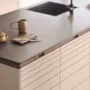 Align kitchen by Rikke Frost for Kvik in clay tone with dark oak handles and organic design lines