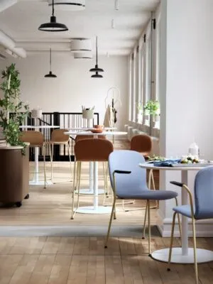 Tinnef café tables in casual gathering space showing sustainable furniture design